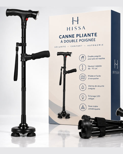 La canne Hissa à double poignée, dépliée, à côté de sa boîte
