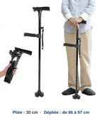 La canne Hissa pliée dans la main (30 cm), dépliée (de 86 à 97 cm), et utilisée debout